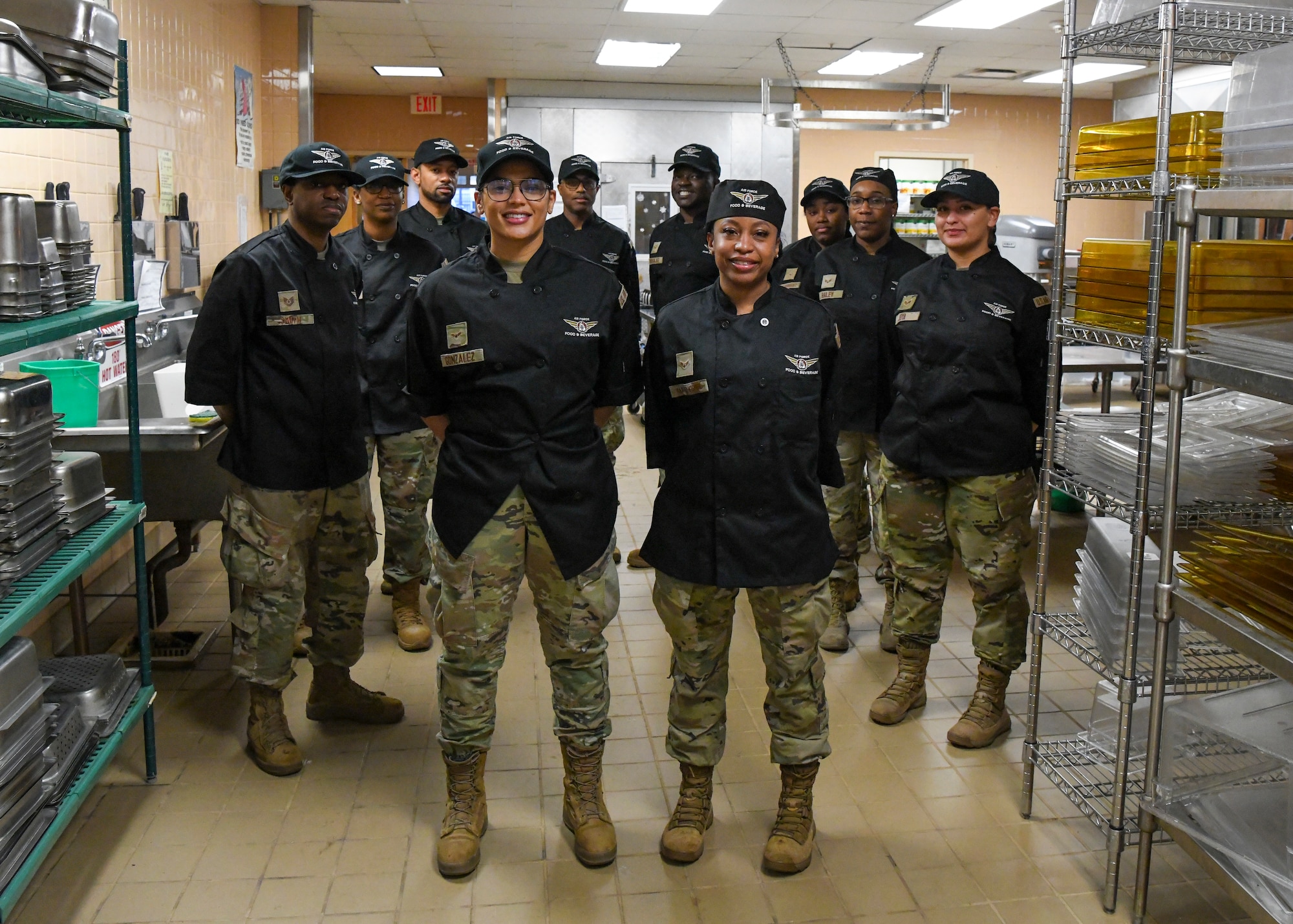 U.S. Air Force services Airmen of the 106th Rescue Wing, showcase their new chef's black uniforms at Francis S. Gabreski Air National Guard Base, Westhampton Beach, New York National Guard, Dec. 3, 2023. The 106th services Airmen debuted their new uniforms during the November drill to enhance functionality and professional appearance. (U.S. Air National Guard photo by Staff Sgt. Kevin J. Donaldson)