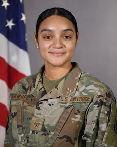 U.S. Air Force Staff Sgt. Paola Sanchez, a knowledge operations management specialist of the 106th Rescue Wing, Francis S. Gabreski Air National Guard Base, WesthamptonBeach, New York ANG, poses for a photo at her workstation, Dec. 3, 2023.