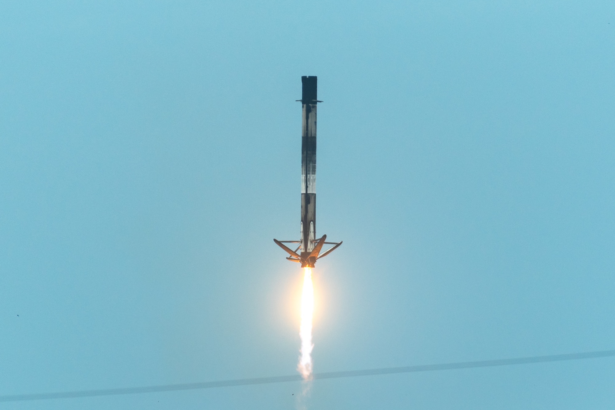 A Falcon 9 booster lands at Landing Zone 1 (LZ-1) at Cape Canaveral Space Force Station.