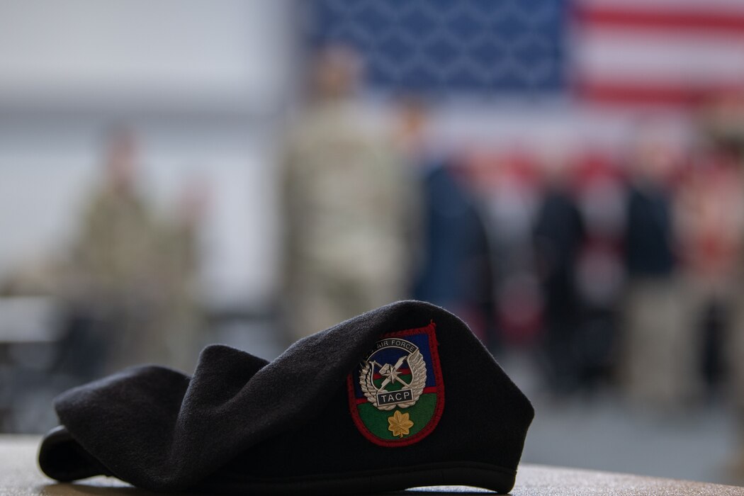 A Tactical Air Control Party beret sits on a table