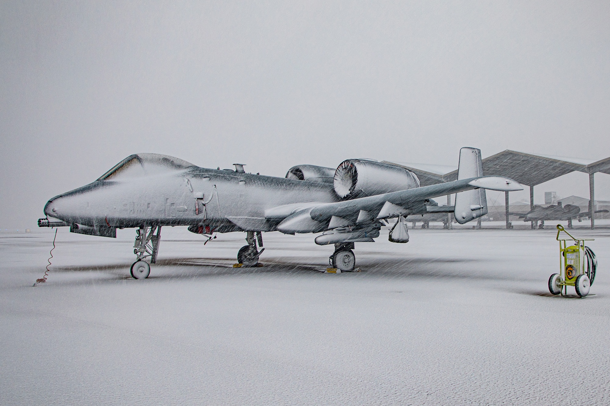 An A-10C Thunderbolt II aircraft is shown parked on the flight line during a winter storm at Selfridge Air National Guard Base, Michigan, on Jan. 12, 2024. Regardless of the temperature, the 127th Wing operates 24 hours a day, 365 days a year, in support of the state and nation.