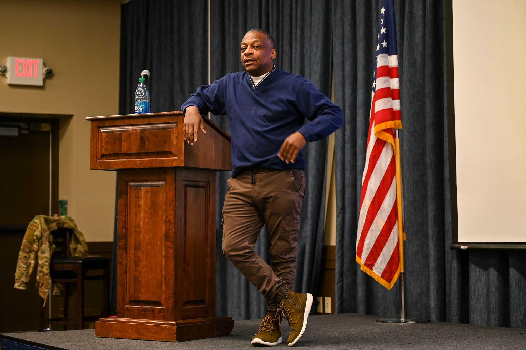 Guest speakers speaks with an Airman