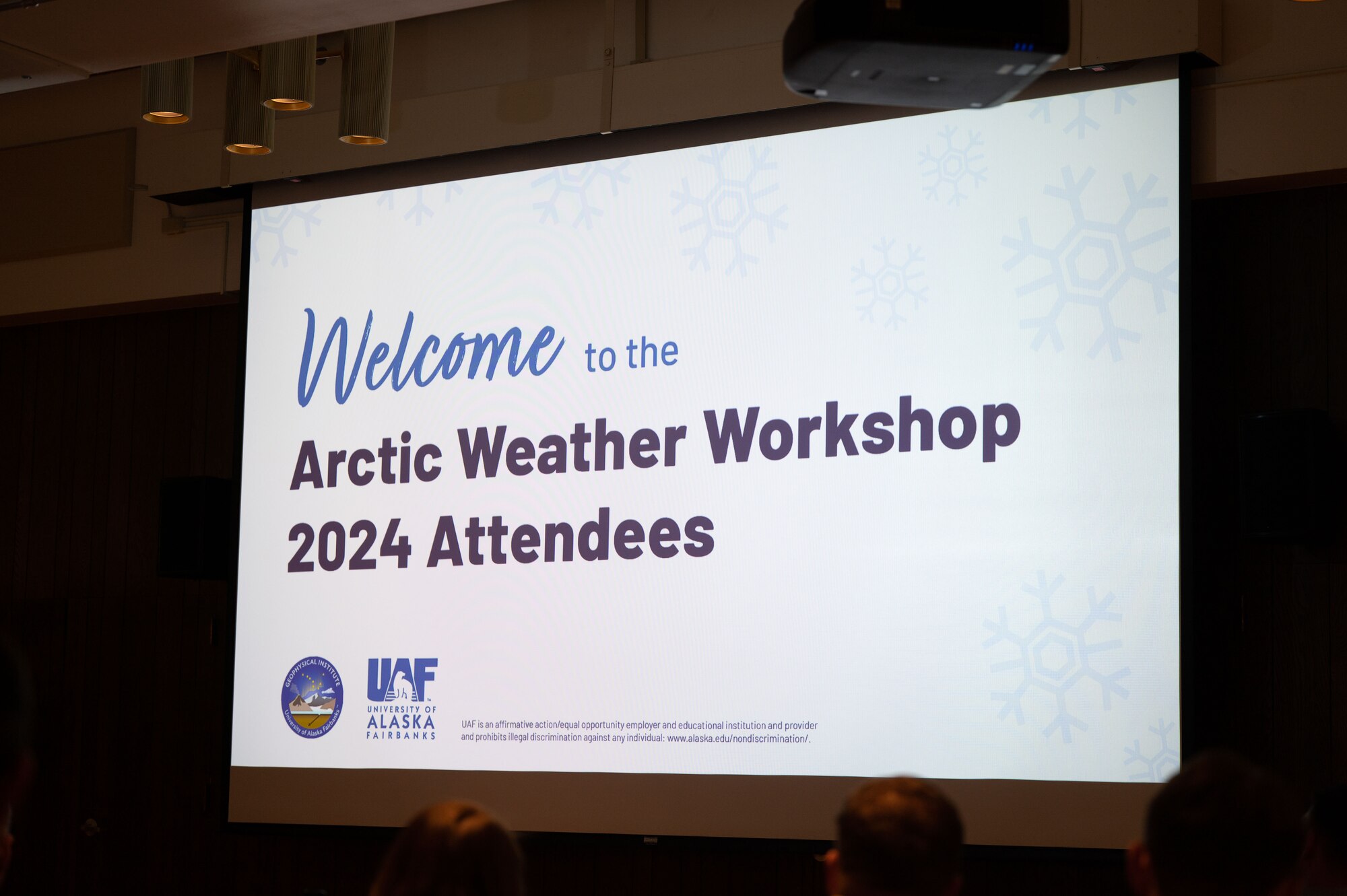 The Arctic Weather Workshop 2024 introductory slide is displayed before various presentations at the University of Alaska Fairbanks campus in Fairbanks, Alaska, Jan. 17, 2024.