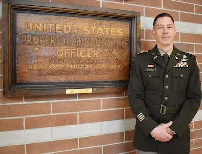 Lt. Col. Andrew Wagner, a longtime Army aviator, on Jan. 19, 2024, becomes the 10th U.S. property and fiscal officer for Nevada since the conclusion of World War II. He is shown on Jan. 17 next to memorabilia saved from Lt. Col. Michael Norton’s stint as the first USPFO for Nevada following the global conflict.