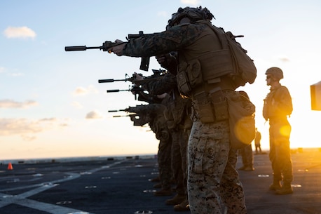 U.S. Marines assigned to Battalion Landing Team 1/6, 26th Marine Expeditionary Unit (Special Operations Capable), execute a live-fire deck shoot aboard the San Antonio-class amphibious ship USS Mesa Verde (LPD 19) in the Mediterranean Sea, Dec. 12, 2023. U.S. Marines and Sailors of the 26th Marine Expeditionary Unit (Special Operations Capable), embarked on the ships of the Bataan Amphibious Ready Group, are on a scheduled deployment with elements deployed to the U.S. 5th Fleet and U.S. 6th Fleet areas of operation to increase maritime security and stability, and to defend U.S., Allied, and Partner interests. (U.S. Marine Corps photo by Staff Sgt. Jesus Sepulveda Torres)