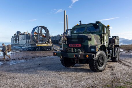 A U.S. Marine Corps medium tactical vehicle replacement, assigned to Combat Logistics Battalions 22, 26th Marine Expeditionary Unit (Special Operations Capable) (26th MEU(SOC)), offloads from a landing craft, air cushion (LCAC) during the 26th MEU(SOC) exercise named “Odyssey Encore,” Volos, Greece, Jan. 8, 2024. The 26th MEU(SOC) readiness sustainment exercise enhances the unit’s operational capabilities as an expeditionary crisis response force and provides an opportunity for the 26th MEU(SOC) to conduct advanced integrated expeditionary operations and live-fire training with both the 32nd and 24th Marine Brigades in Greece. The Bataan Amphibious Ready Group, with the embarked 26th MEU(SOC), is on a scheduled deployment in the U.S. Naval Forces Europe area of operations, employed by U.S. Sixth Fleet to defend U.S., Allied and partner interests. (U.S. Marine Corps photo by Cpl. Rafael Brambila-Pelayo)