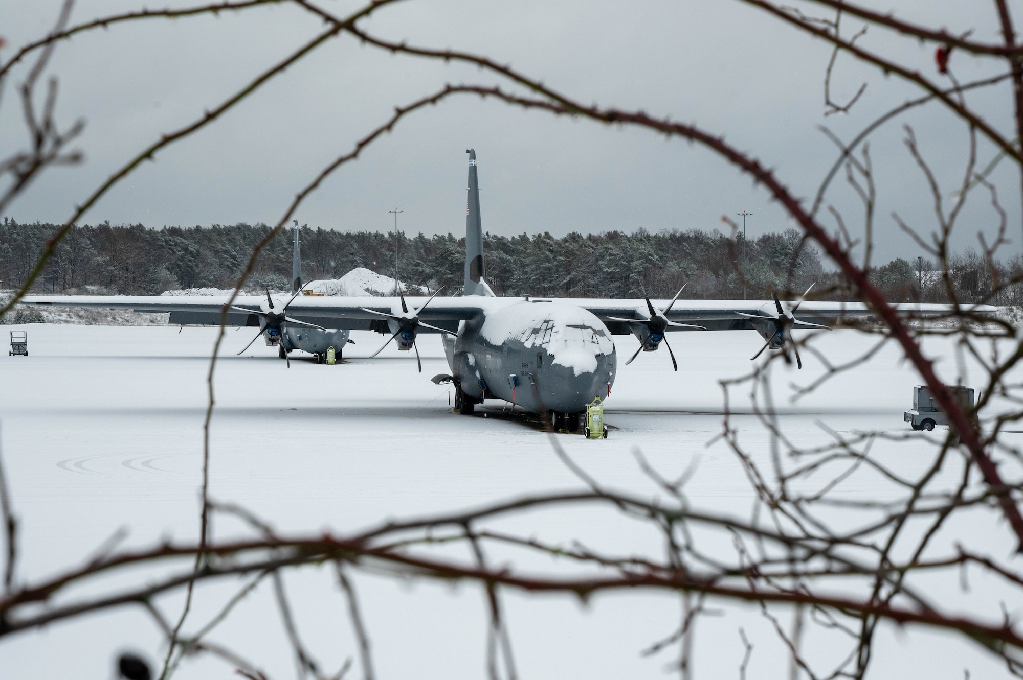 A C-130J Super Hercules aircraft sits on the flightline