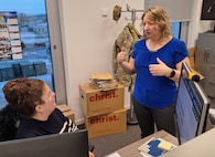 Hanni Marchuk, the chief of plans and operations at Logistics Readiness Center Wiesbaden, (right) speaks to Haciba Lathrache, an administrative specialist at their office in Wiesbaden, Germany. Marchuk arrived to Wiesbaden in December after 22 years of working for the Army in Alaska. (U.S. Army courtesy photo)
