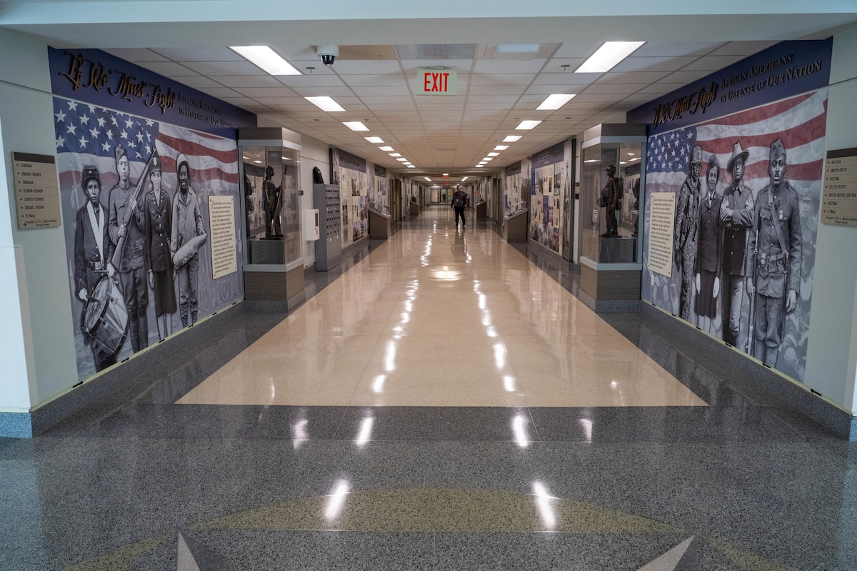 A long shot down a corridor that is the start of the Pentagon picture exhibit honoring military contributions of African Americans.
