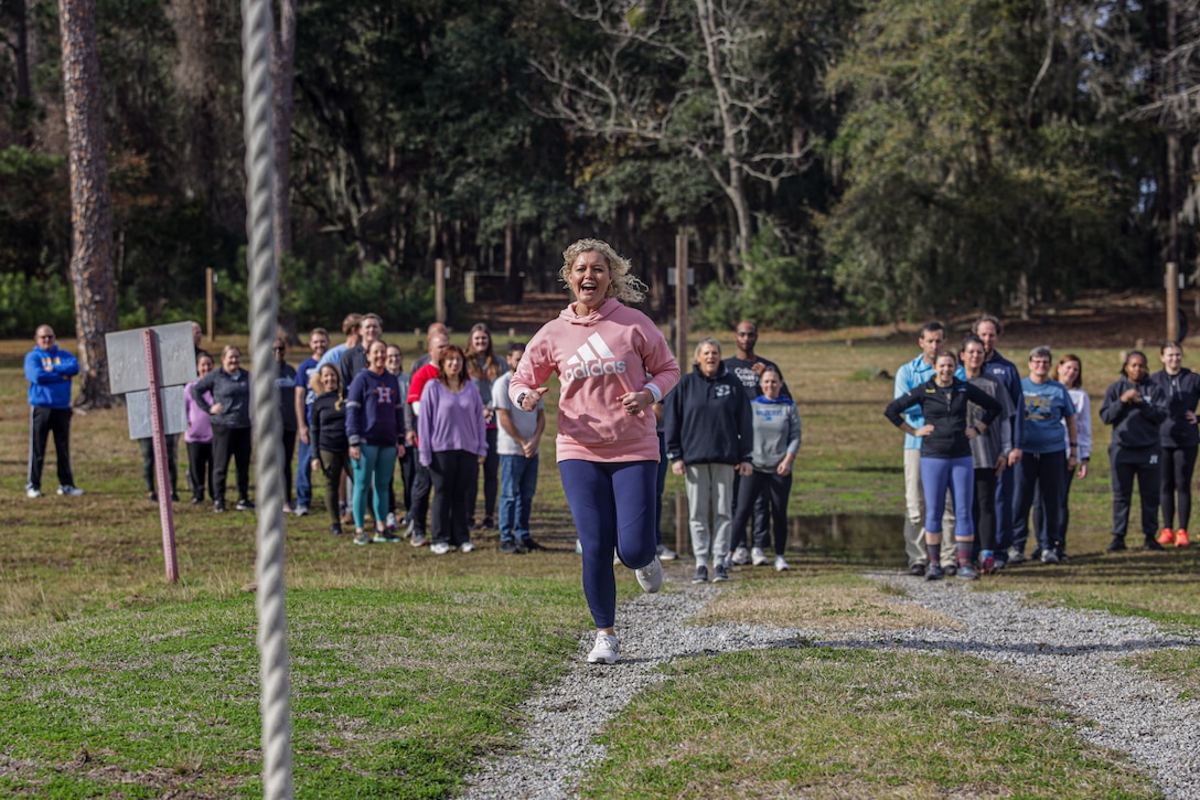 Sarah Lohr, a school counselor with Orange County High School, sprints toward the rope at the obstacle course during the Educator’s Workshop at Marine Corps Recruit Depot (MCRD) Parris Island, South Carolina, January 11, 2024. The workshop is a program that invites select educators and community influencers onto MCRD Parris Island to provide insight on how the Marine Corps transforms young men and women into United States Marines. (U.S. Marine Corps photo by Cpl. Jennifer Delacruz)