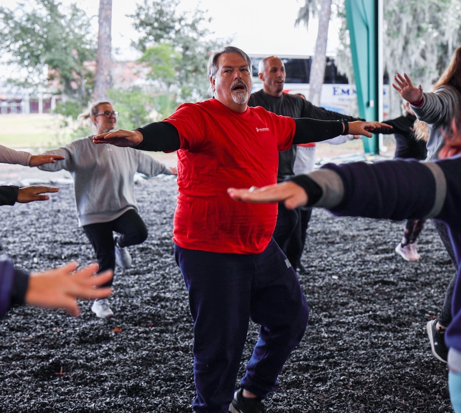 James Stoecker, a graduation coach with York County High School, Yorktown, Virginia executes high knees during a Marine Corps Martial Arts Program demonstration as part of the Marine Corps Educators Workshop, January 11, 2024, at Marine Corps Recruit Depot Parris Island. The program is designed to demystify recruit training, foster stronger relationship among recruiting personnel and the communities they serve, and increase advocacy among influencers who help shape decisions of young men and women. (U.S. Marine Corps photo by Sgt. Godfrey Ampong)