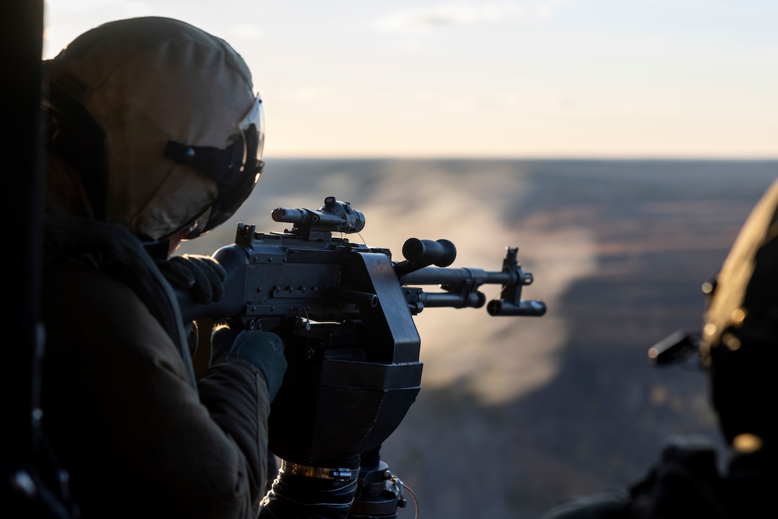 A U.S. Marine with Marine Medium Tiltrotor Squadron 365, 24th Marine Expeditionary Unit, fires an M240B machine gun out of a UH-1Y Venom during a close air support exercise as part of Realistic Urban Training on Fort Barfoot, Virginia, Jan. 20, 2024. RUT provides the 24th MEU the opportunity to operate in unfamiliar environments, integrate the units of the Marine Air Ground Task Force, and train towards being designated as special operations capable.