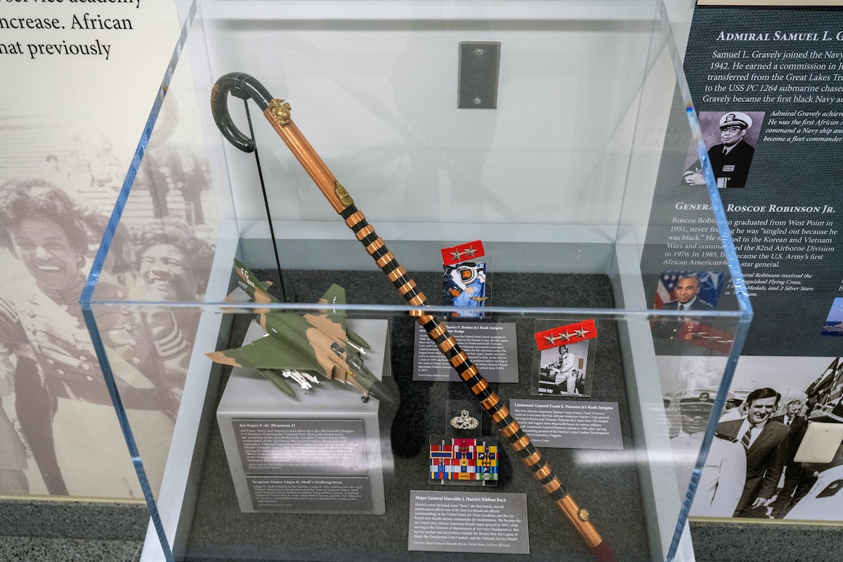 A display case holds numerous artifacts of service members throughout history.