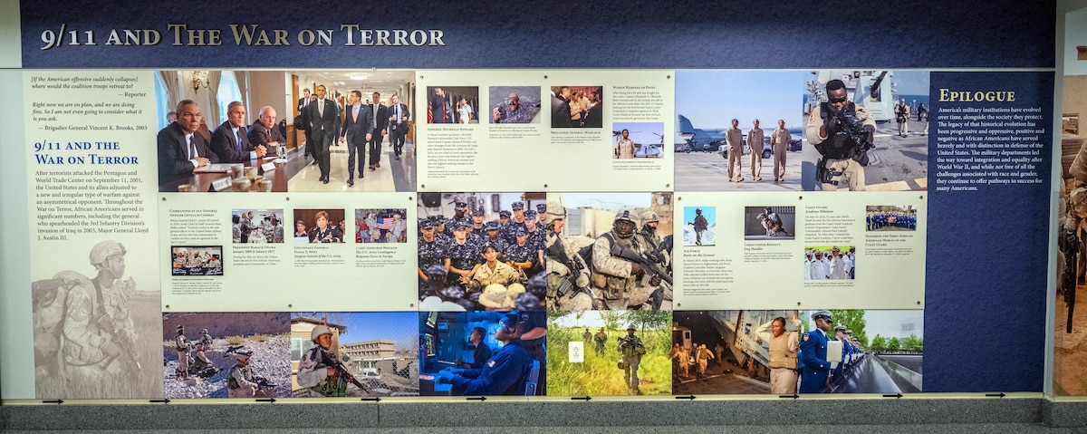 An infographic of pictures and text on a wall depicting African Americans who served in the military during 9/11 and The War on Terror.