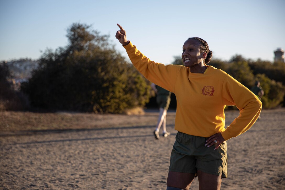 U.S. Marine Corps Sgt. Maj. Amina Saracay, 2nd Battalion's sergeant major,  motivates recruits with Hotel Company, 2nd Recruit Training Battalion during the running portion of their initial strength test at Marine Corps Recruit Depot San Diego, Jan. 12, 2023. The IST is a baseline fitness test for the new recruits to ensure they meet the physical requirements to begin the 13-week transformation to earn the title United States Marine. (U.S. Marine Corps photo by Lance Cpl. Sarah Grawock)