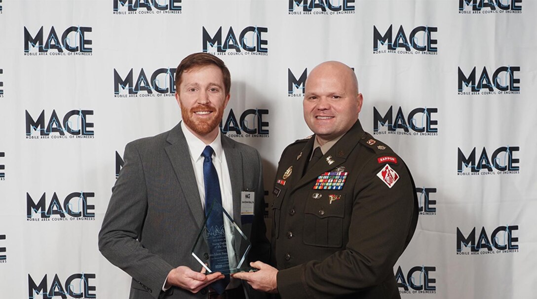 John Bass, Senior Engineering Technical Lead for Civil Works, alongside LTC Gary Cutler, Deputy Commander of Mobile District, captured at the 2024 MACE award ceremony on January 18, 2024, in Mobile, Ala. Bass received 2024 ‘Young Engineer of the Year’ award. (Courtesy photo)