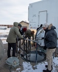 Col. Kenneth McGhee, 91st Missile commander, gives members of the Department of State a tour of training Launch Facility Uniform-01 at Minot Air Force Base, North Dakota, Jan. 18, 2024. During the tour, McGhee showed and explained the mechanics of the launcher closure door, and how it protects a Minute Man III while also having the ability to open swiftly. (U.S. Air Force photo by Senior Airman Evan Lichtenhan)