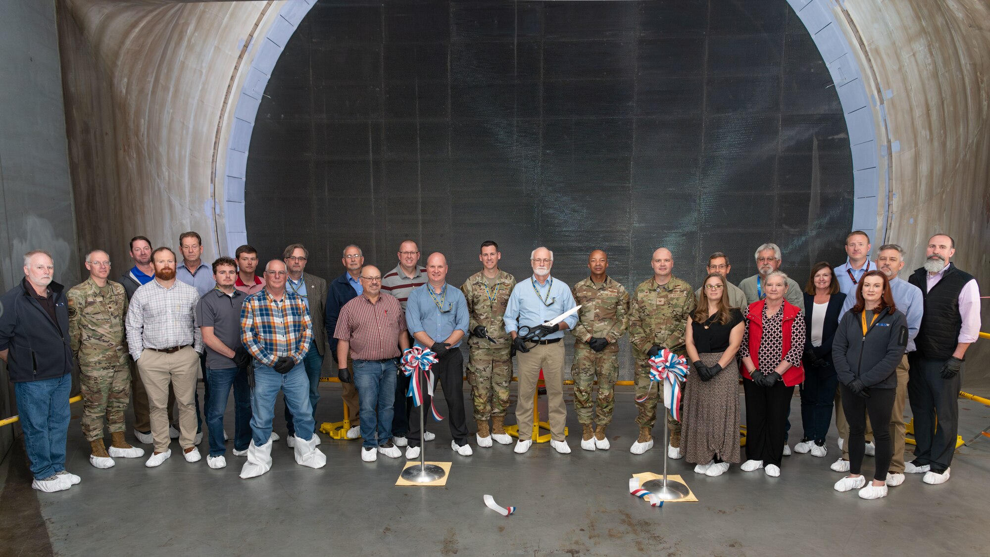 Arnold Engineering Development Complex leaders and team members involved with the “honeycomb” installation project gather for a photo in front of the recently-installed structure in the 16-foot supersonic wind tunnel at Arnold Air Force Base, Tenn., headquarters of AEDC. The installation process was completed in October. (U.S. Air Force photo by Keith Thornburgh)