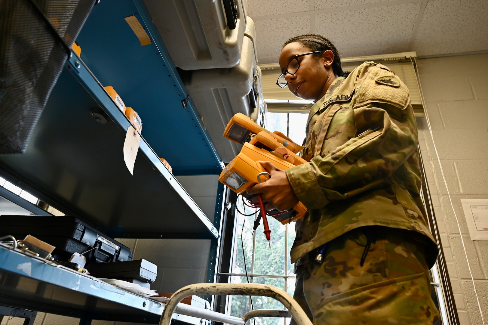 Spc. Jasmine Felton, a District of Columbia National Guard electronics and calibration technician within the Test Measurement Diagnostic Equipment (TMDE) section, conducts inventory at the Surface Equipment Maintenance Facilities/Combined Support Maintenance Shop at Joint Base Anacostia-Bolling, Jan. 18, 2024.Standardized measurements ensure weapons systems from aircraft to mission-critical vehicles operate safely and effectively.