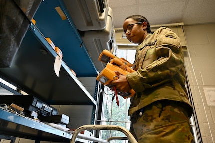 Spc. Jasmine Felton, a District of Columbia National Guard electronics and calibration technician within the Test Measurement Diagnostic Equipment (TMDE) section, conducts inventory at the Surface Equipment Maintenance Facilities/Combined Support Maintenance Shop at Joint Base Anacostia-Bolling, Jan. 18, 2024.Standardized measurements ensure weapons systems from aircraft to mission-critical vehicles operate safely and effectively.