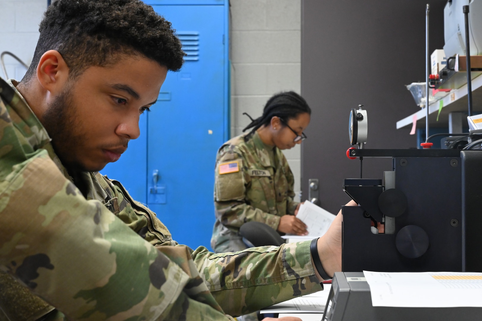 Spc. John Parker, a District of Columbia National Guard electronics and calibration technician within the Test Measurement Diagnostic Equipment (TMDE) section, inspects a dial pressure gauge at the Surface Equipment Maintenance Facilities/Combined Support Maintenance Shop at Joint Base Anacostia-Bolling, Jan. 18, 2024.Standardized measurements ensure weapons systems from aircraft to mission-critical vehicles operate safely and effectively.