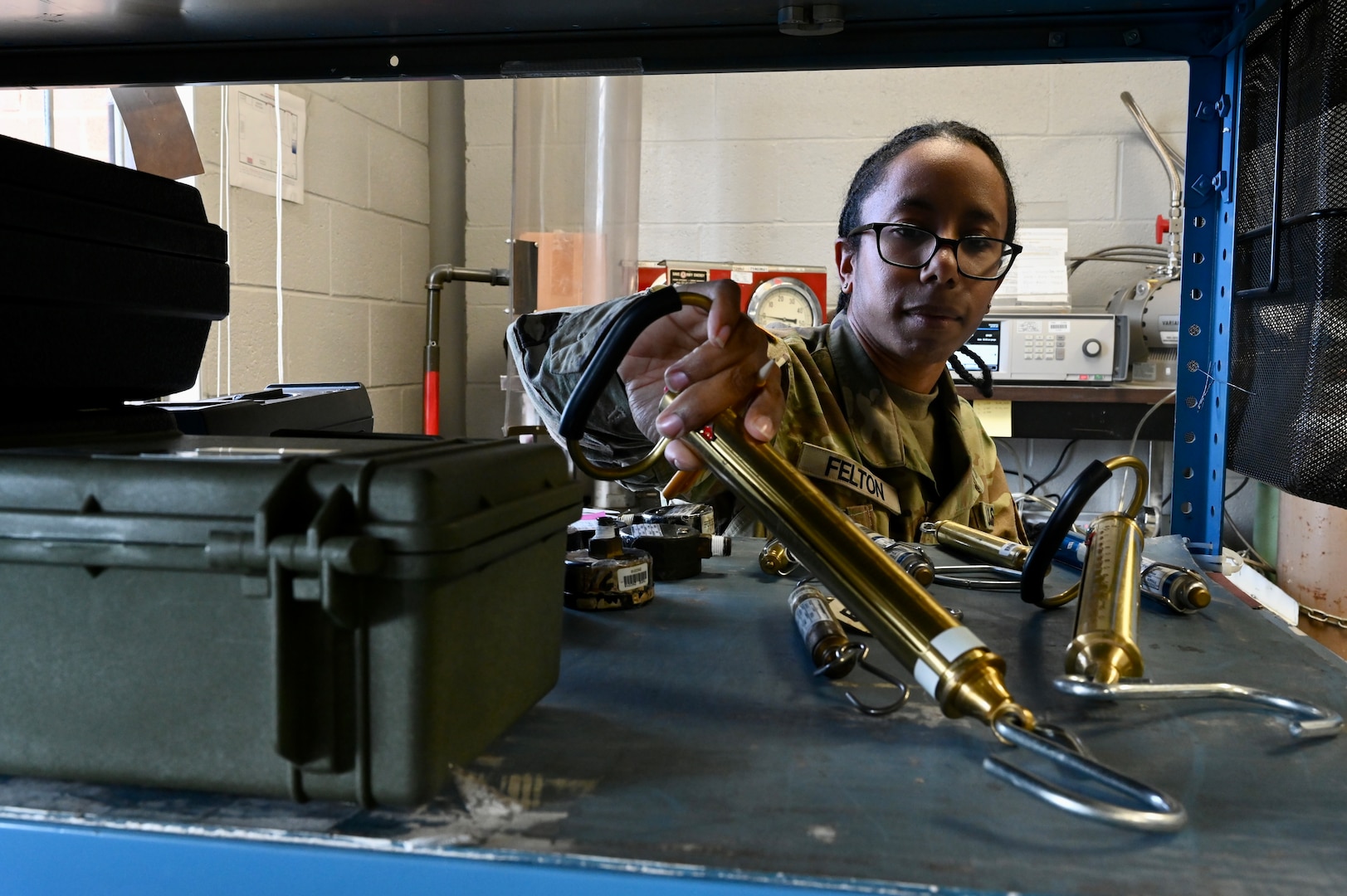 Spc. Jasmine Felton, a District of Columbia National Guard electronics and calibration technician within the Test Measurement Diagnostic Equipment (TMDE) section, inventories mechanical tube scales at the Surface Equipment Maintenance Facilities/Combined Support Maintenance Shop at Joint Base Anacostia-Bolling, Jan. 18, 2024. Standardized measurements ensure weapons systems from aircraft to mission-critical vehicles operate safely and effectively.