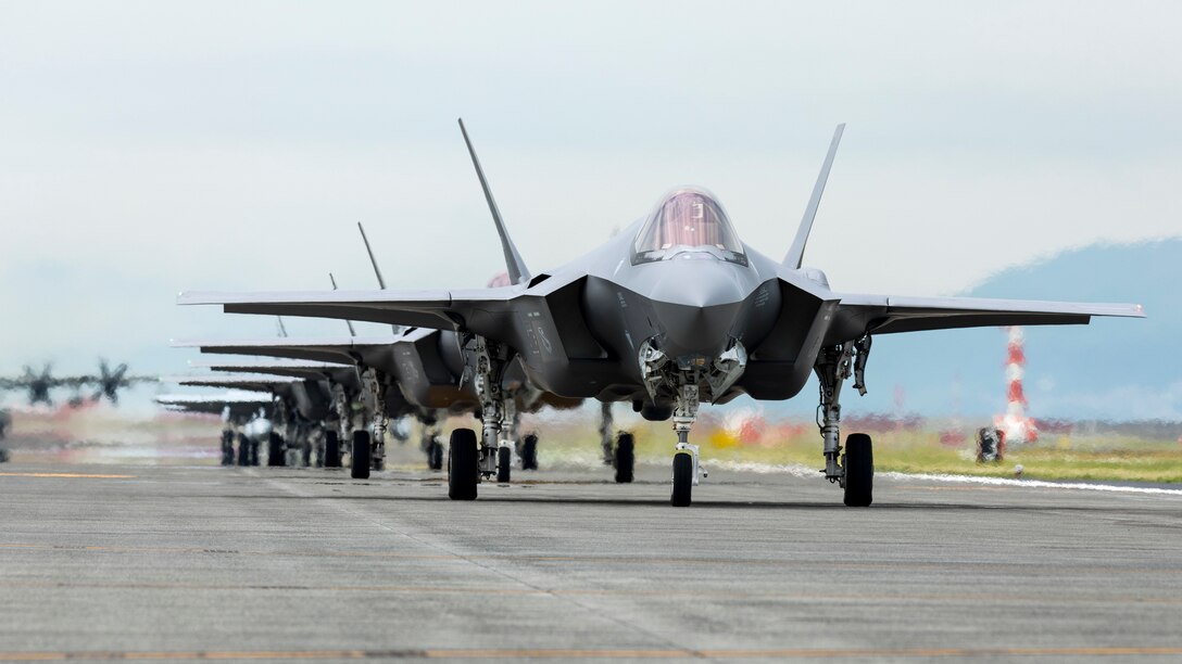 The U.S. Air Force 354th Air Expeditionary Wing and Marine Aircraft Group 12 performed a capabilities demonstration during a pre-planned readiness exercise at Marine Corps Air Station Iwakuni, Japan, July 7, 2022. The demonstration included U.S. Marine Corps F/A-18 Hornets, F-35B Lighting IIs, KC-130J Super Hercules aircraft, and U.S. Air Force F-22 Raptors and F-35A Lighting II aircraft, showcasing a high level of readiness and joint service capability in support of a free and open Indo-Pacific. (U.S. Marine Corps photo by Sgt. Jackson Ricker)
