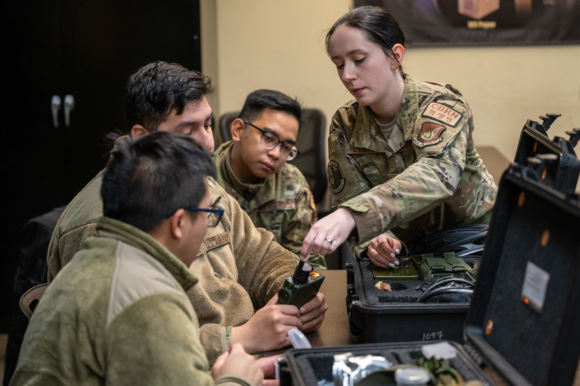 U.S. Air Force Airman 1st Class Kylah Deroche, 51st Civil Engineer Squadron emergency management apprentice, trains Airmen on how to use a joint chemical agent detector during Shelter Management Training at Osan Air Base, Republic of Korea, Jan. 17, 2024. Airmen undergo SMT to be able to carry out the responsibility of managing a collective protective shelter in the event of a simulated or real-world threat. (U.S. Air Force photo by Staff Sgt. Thomas Sjoberg)