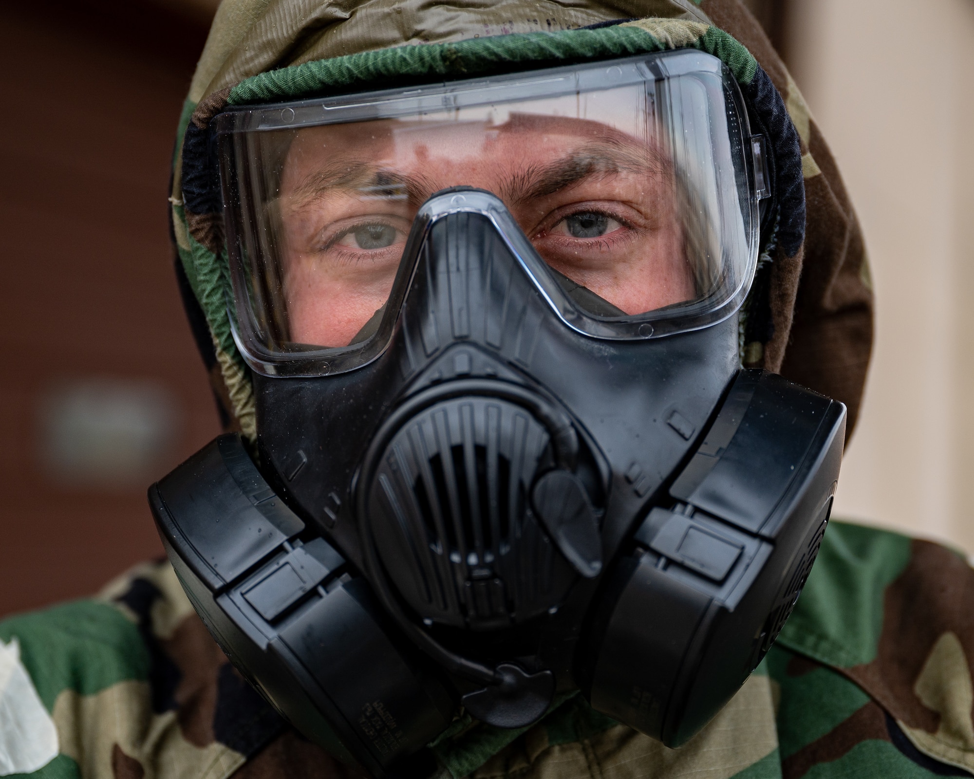 U.S. Air Force Airman 1st Class Chase Verzaal, 51st Fighter Wing public affairs apprentice, practices decontamination procedures during Shelter Management Training at Osan Air Base, Republic of Korea, Jan. 17, 2024. Decontamination procedures are carried out to ensure the safety of Airmen. These procedures are essential to prevent harmful contaminants from being introduced into collective protective shelters. (U.S. Air Force photo by Staff Sgt. Thomas Sjoberg)
