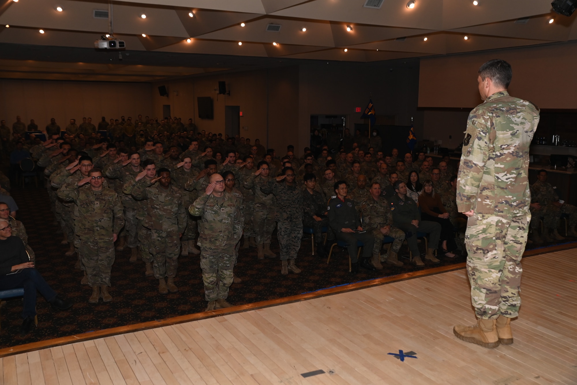 Members of the 607th Air Operations Center render a first salute to Col. Tanner Woolsey, 607th AOC incoming commander, during an assumption of command ceremony at Osan Air Base, Republic of Korea, Jan. 11, 2024.