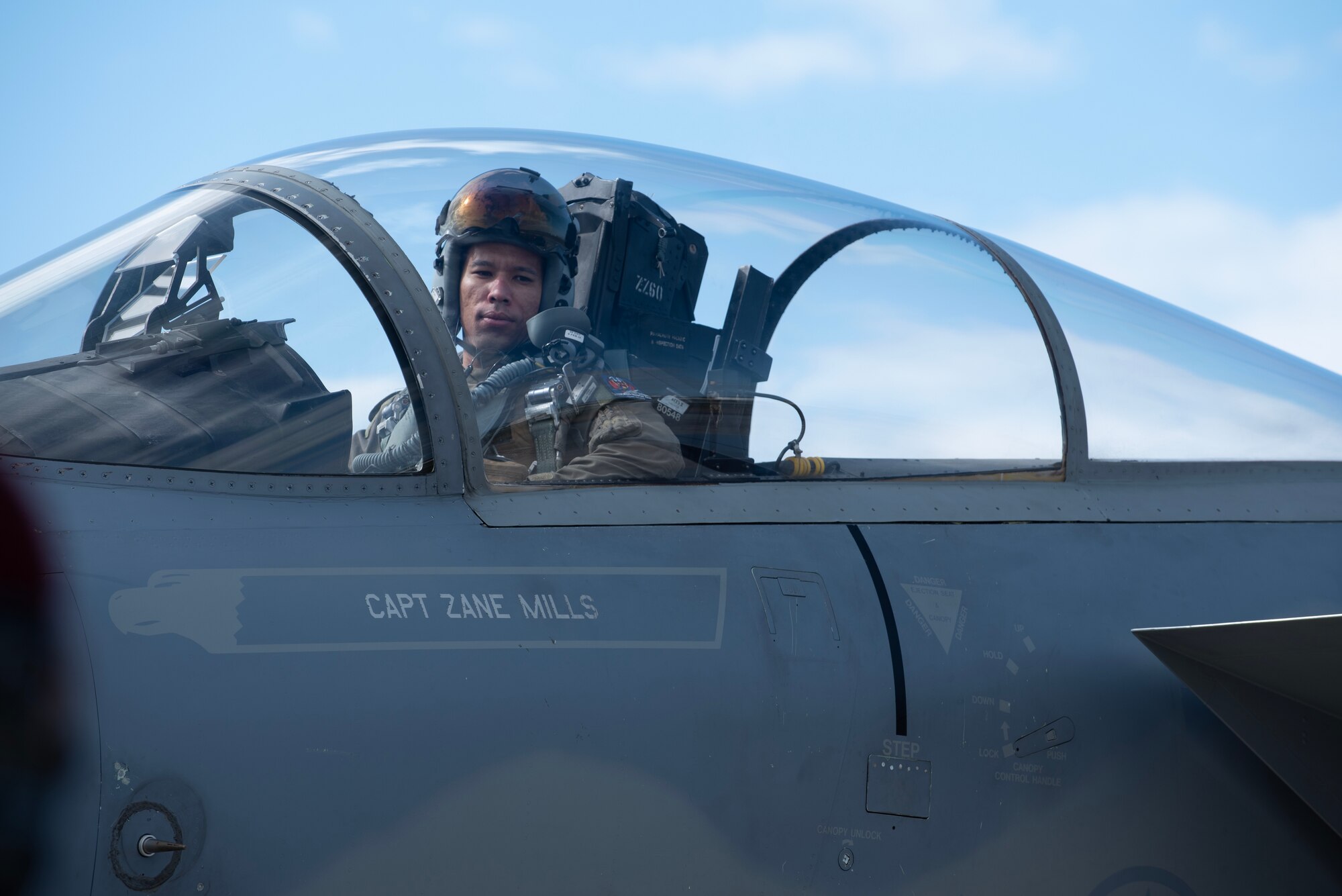 pilot looks out of cockpit window