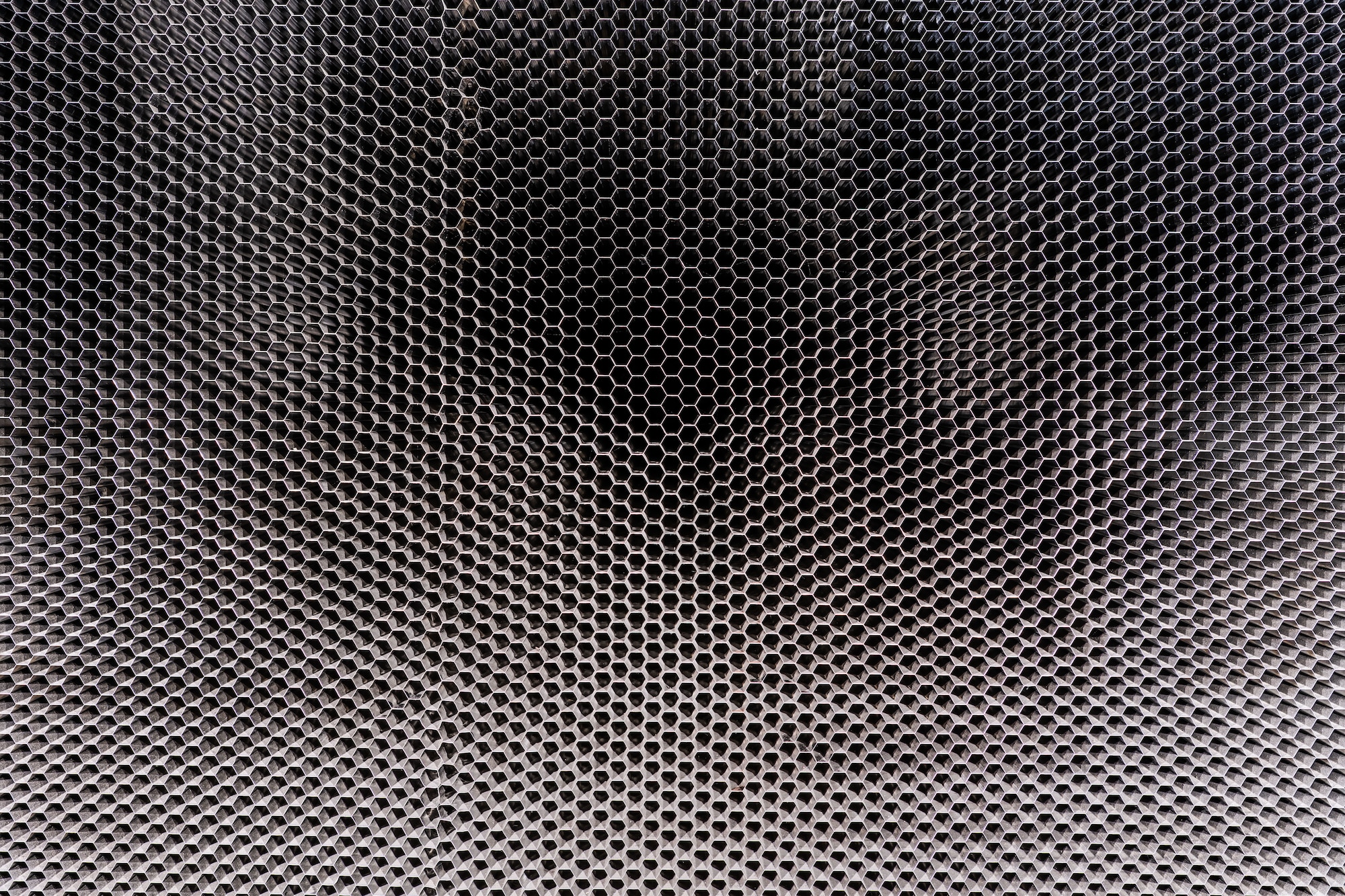 The “honeycomb” structure in the 16-foot supersonic wind tunnel at Arnold Air Force Base, Tenn., is shown. The purpose of the honeycomb is to enhance wind tunnel flow quality. The installation process was completed in October 2023. The honeycomb is a single-piece structure that measures 55 feet in diameter, 4 feet thick and weighs more than 67 tons. It is made up of thousands of stainless steel 1-inch hexagonal honeycomb tubes. (U.S. Air Force photo by Keith Thornburgh)