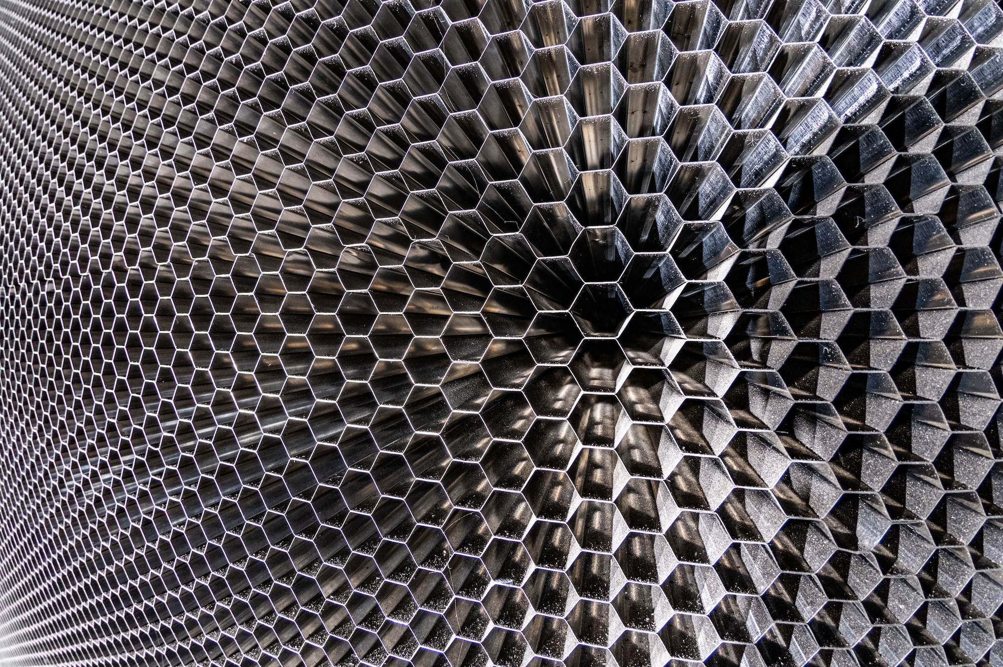 A closeup of the “honeycomb” structure in the 16-foot supersonic wind tunnel at Arnold Air Force Base, Tenn., is shown. The purpose of the honeycomb is to enhance wind tunnel flow quality. The installation process was completed in October 2023. The honeycomb is a single-piece structure that measures 55 feet in diameter, 4 feet thick and weighs more than 67 tons. It is made up of thousands of stainless steel 1-inch hexagonal honeycomb tubes. (U.S. Air Force photo by Keith Thornburgh)