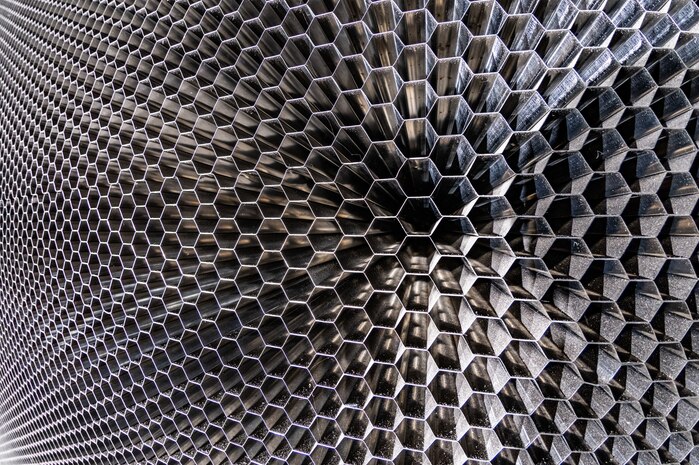 A closeup of the “honeycomb” structure in the 16-foot supersonic wind tunnel at Arnold Air Force Base, Tenn., is shown. The purpose of the honeycomb is to enhance wind tunnel flow quality. The installation process was completed in October 2023. The honeycomb is a single-piece structure that measures 55 feet in diameter, 4 feet thick and weighs more than 67 tons. It is made up of thousands of stainless steel 1-inch hexagonal honeycomb tubes. (U.S. Air Force photo by Keith Thornburgh)