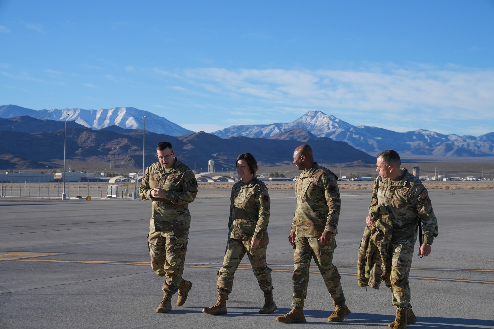 Cheif Bass walks on the flight line with wing leadership.