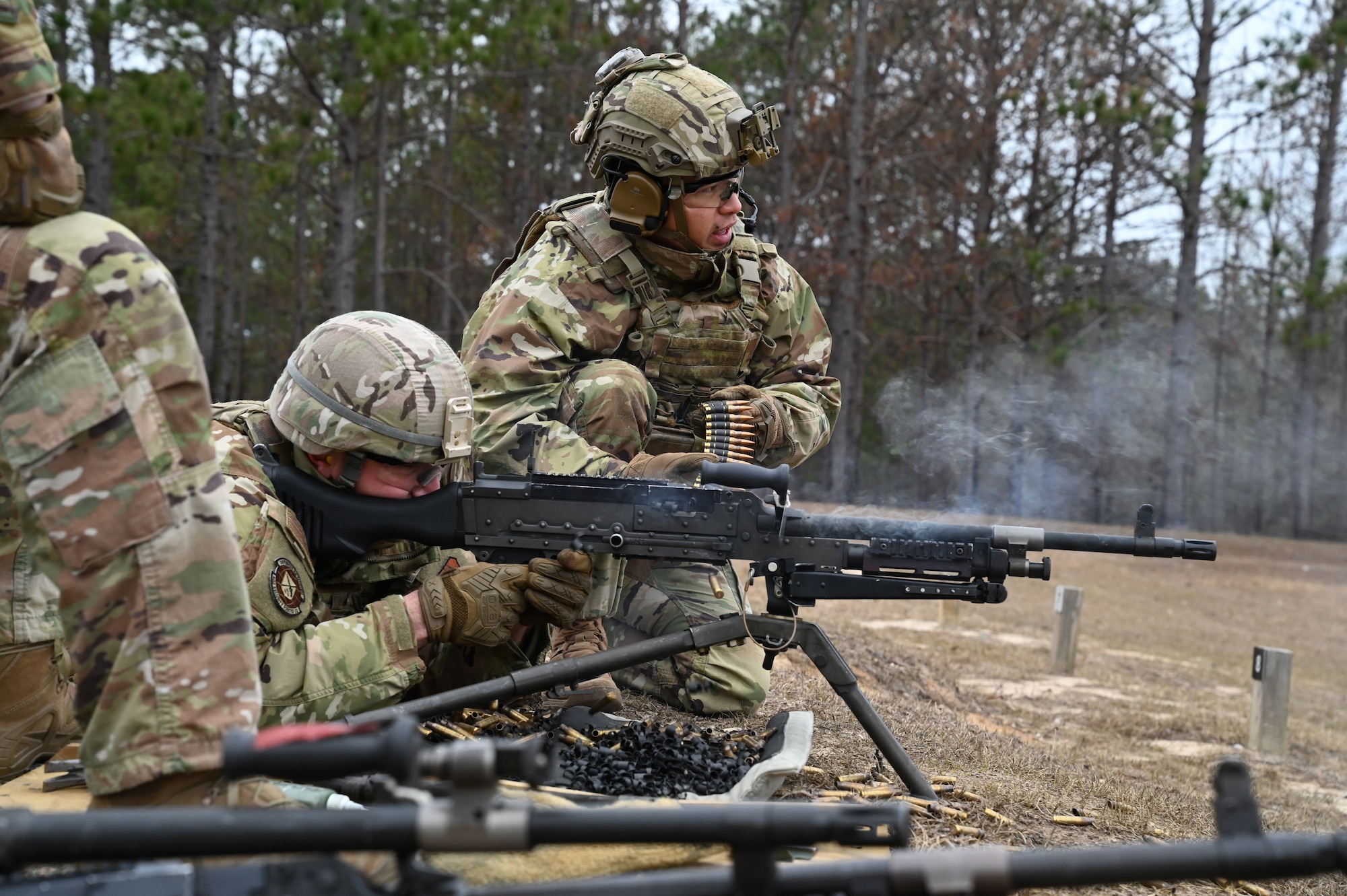 Air Force Reserve members fire heavy weapons.