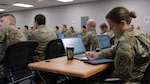 Maj. Lucy Paterson, an Army surge provider, takes notes while attending prescreen training at USMEPCOM HQ in North Chicago, Ill., Jan. 9 -12. The Army deployed more than 60 providers and 46 medical technicians to MEPS across the country to support applicant processing during the busiest time of year.