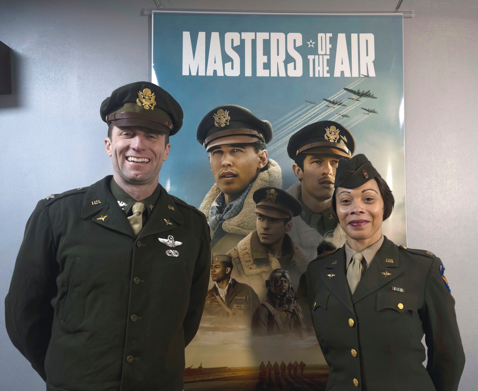 U.S. Air Force Col. Ryan Garlow, left, 100th Air Refueling Wing commander, and Chief Master Sgt. Tiffany Griego, 100th ARW command chief, wear authentic World War II uniforms at a premiere of the first episode of the upcoming “Masters of the Air” miniseries at Royal Air Force Mildenhall, England, Jan. 19, 2024. The upcoming nine-part series on Apple TV+ highlights the legacy of the Eighth Air Force and 100th Bomb Group at Thorpe Abbotts, England, to which the 100th ARW has direct ties. (U.S. Air Force photo by Senior Airman Alvaro Villagomez)