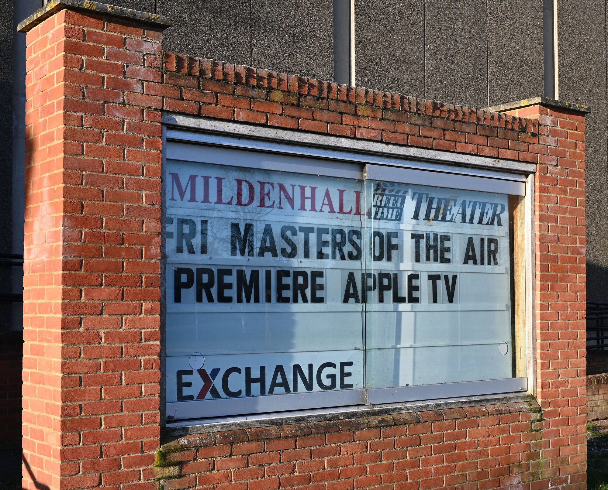 The display board at the base theater highlights the special premiere of the first episode of “Masters of the Air” at Royal Air Force Mildenhall, England, Jan. 19, 2024. U.S. Air Force Airmen, civilians and invited guests watched episode one of the soon-to-be-released nine-part series on Apple TV+, which highlights the legacy of both Eighth Air Force and 100th Bomb Group at Thorpe Abbotts, England, to which the 100th ARW has direct ties. (U.S. Air Force photo by Karen Abeyasekere)