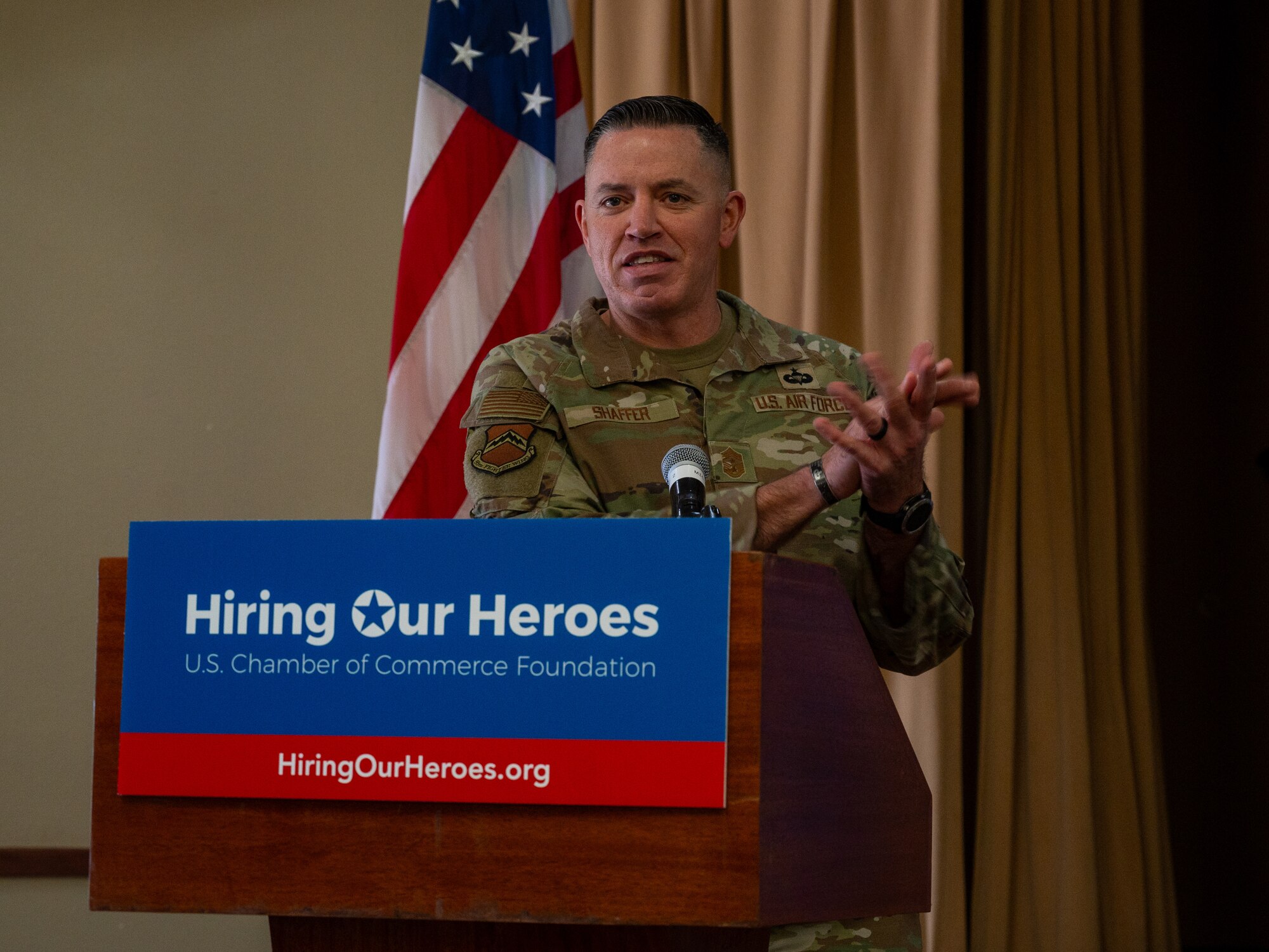 U.S. Air Force Chief Master Sgt. Jason Shaffer, 56th Fighter Wing command, speaks at the Hiring our Heroes Career Expo, Jan 18, 2024 at Luke Air Force Base, Arizona. Jan 18, 2024 at Luke Air Force Base, Arizona.