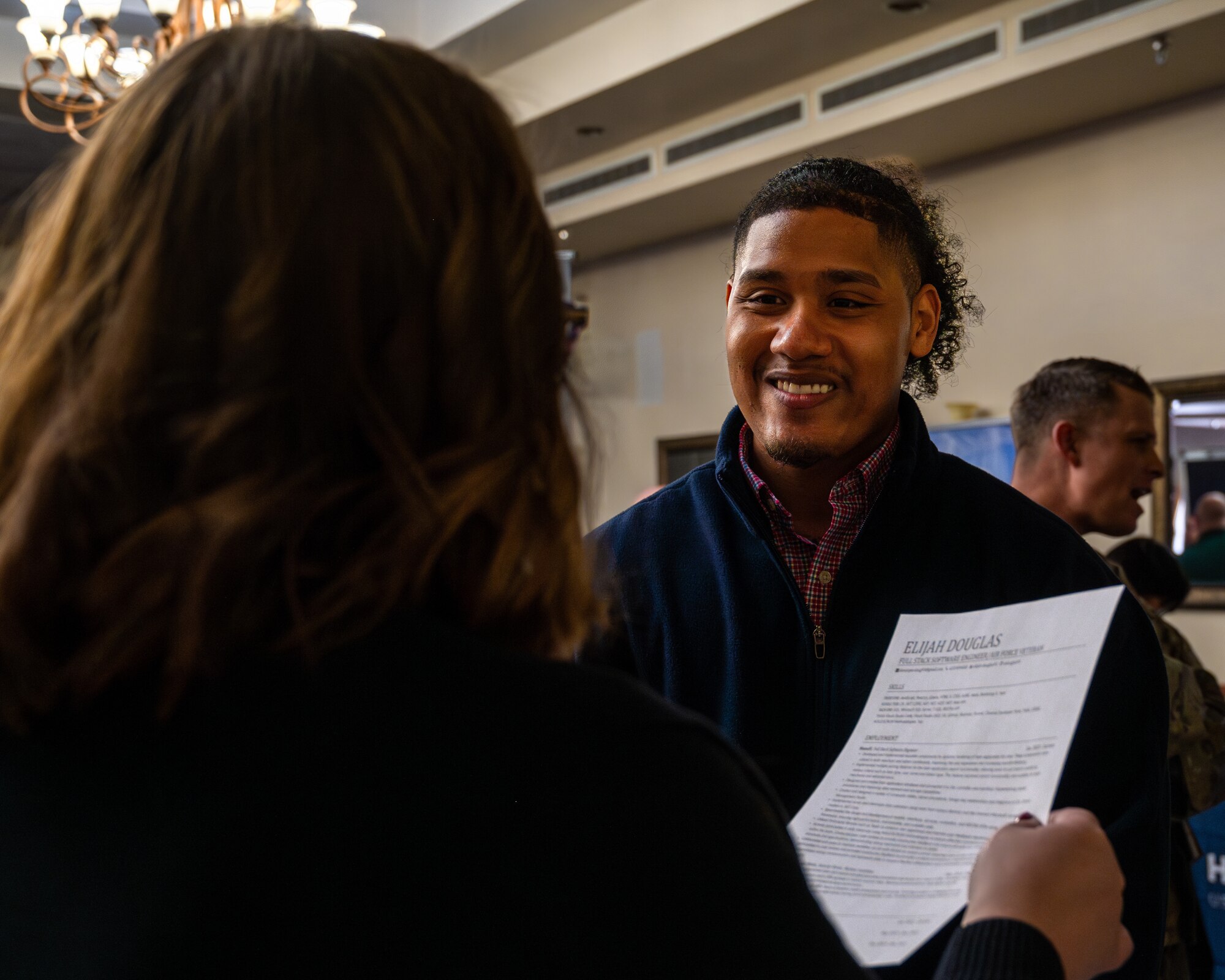 U.S. Air Force veteran Elijah Douglas, speaks with an Amazon recruiter during the Hiring our Heroes Career Expo, Jan 18, 2024 at Luke Air Force Base, Arizona.