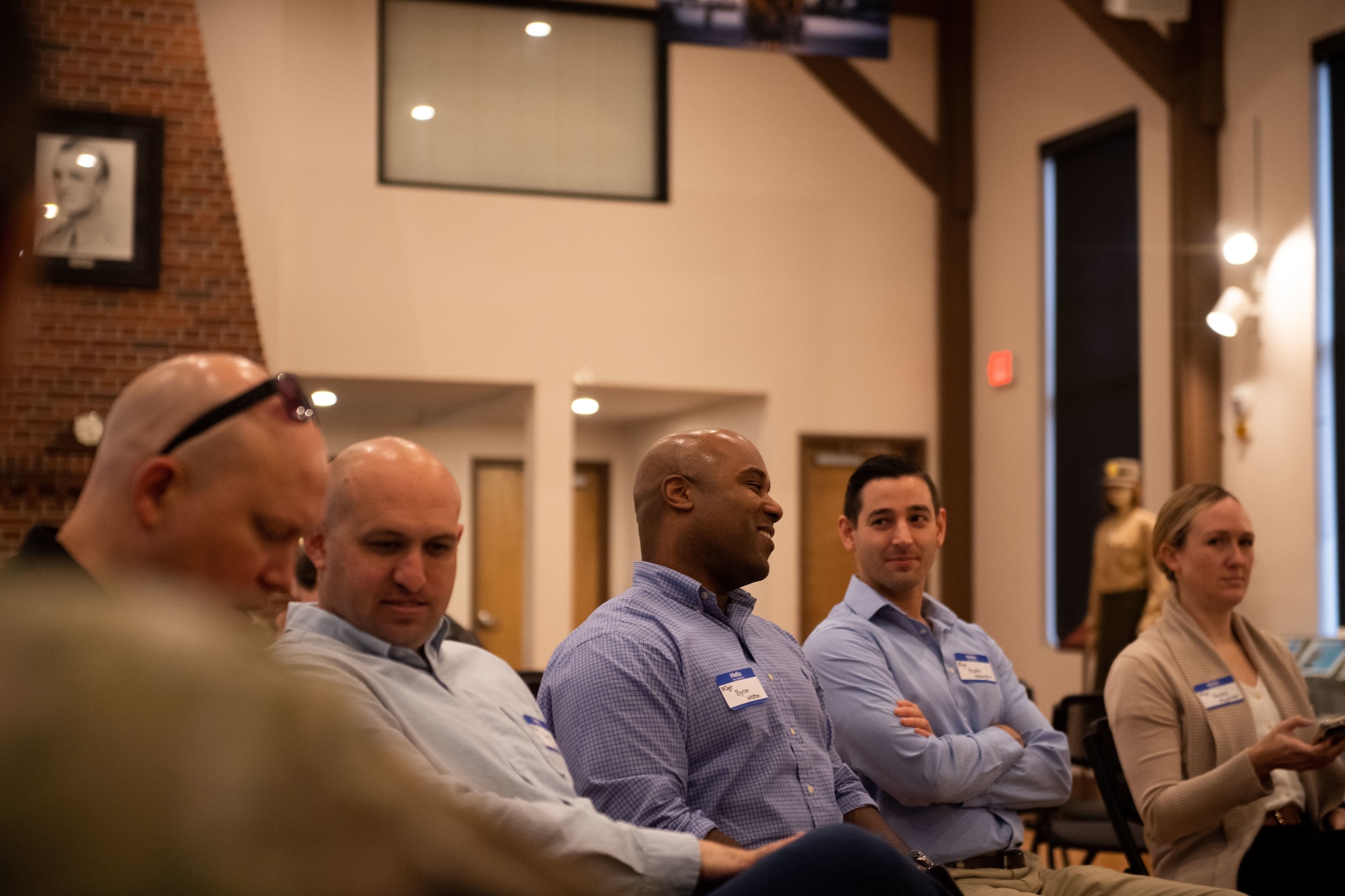 A group of community leaders talk during emerge moody