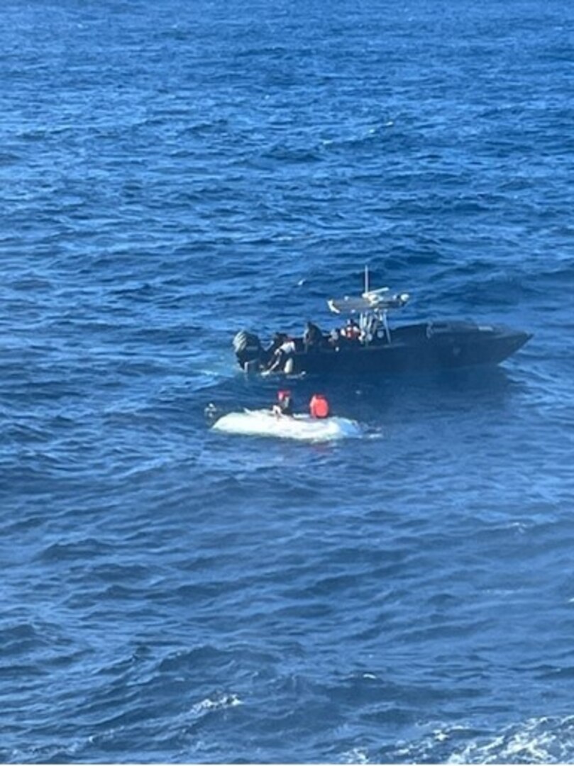 A Puerto Rico Police Joint Forces of Rapid Action marine unit rescues three boaters from a capsized vessel just off Desecheo Island, Puerto Rico, Jan. 23, 2024, during a joint response with a Coast Guard MH-60T Jayhawk helicopter and the Coast Guard Cutter Richard Dixon.  All three boaters were safely transported to the Police Joint Forces of Rapid Action Boat Station in Añasco, Puerto Rico, no injuries or medical concerns were reported in this case.  (U.S. Coast Guard photo)