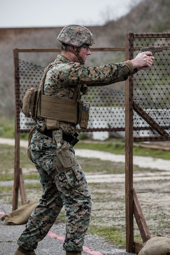U.S. Marine Corps Cpl. Alexander Devereux, a combat photographer, with Headquarters and Service Battalion, Marine Corps Recruit Depot San Diego, fires an M18 during the Depot Competition in Arms Program on Marine Corps Base Camp Pendleton, California, Jan. 17, 2024. The Depot Competition in Arms Program enhances the marksmanship proficiency of Marines and sends the top three shooters to compete with the depot shooting team at the Marine Corps Marksmanship Competition. Devereux is from Farmington Hills, Michigan. (U.S. Marine Corps photo by Lance Cpl. Alexandra M. Earl)