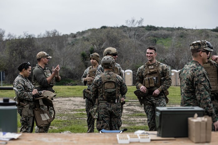 U.S. Marines and Coast Guardsmen wait to shoot the M18 during the Depot Competition in Arms Program on Marine Corps Base Camp Pendleton, California, Jan. 17, 2024. The Depot Competition in Arms Program enhances the marksmanship proficiency of Marines and sends the top three shooters to compete with the depot shooting team at the Marine Corps Marksmanship Competition. (U.S. Marine Corps photo by Lance Cpl. Alexandra M. Earl)