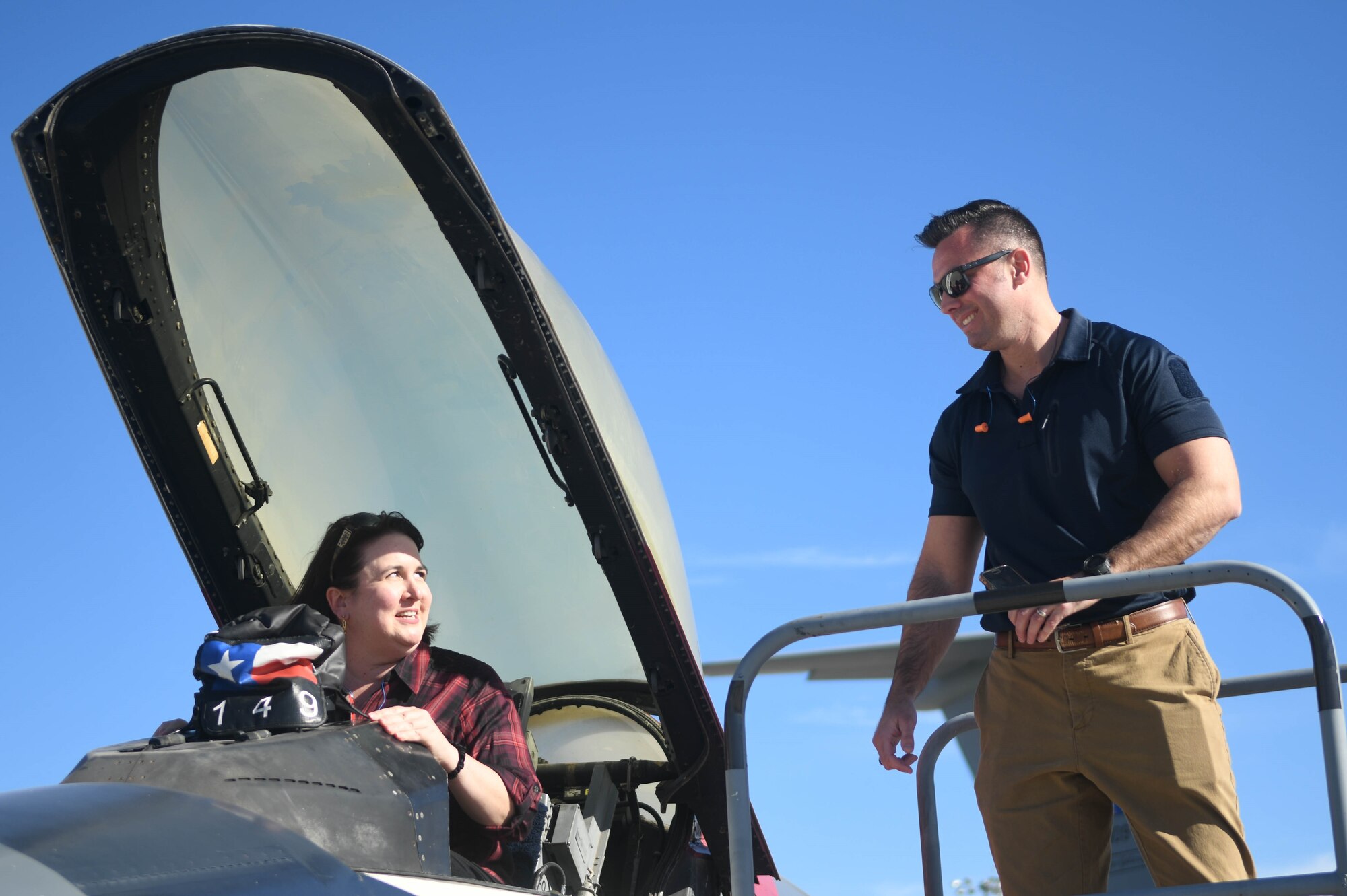Brian E. Hoffman, right, 502nd Air Base Wing vice director, shows the internal compartment of a F-16 fighter jet to Kelli Rhodes, left, member of Leaders of San Antonio during a visit to Joint Base San Antonio-Lackland, Texas, Jan. 18, 2024.