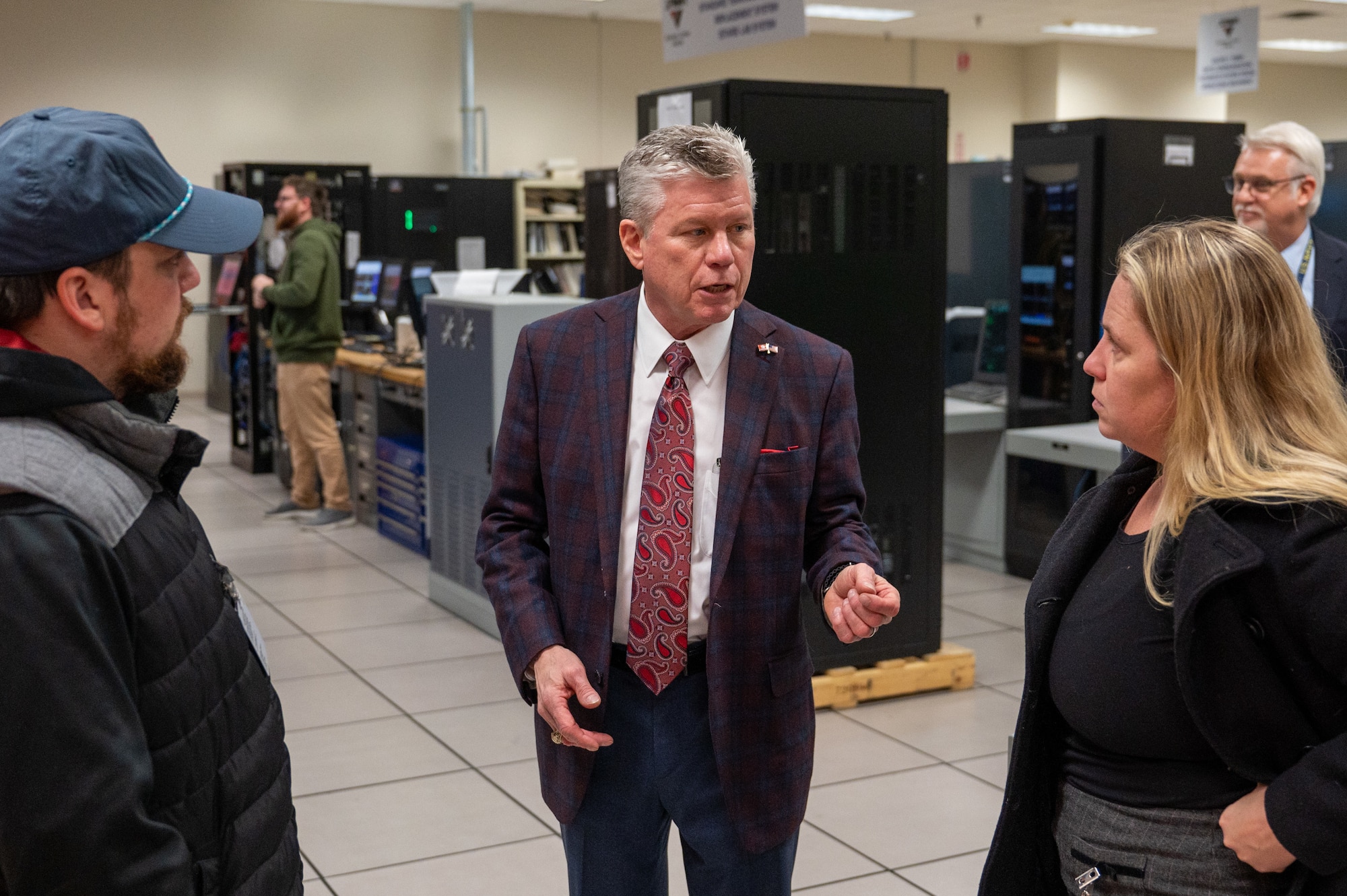 A photo of Rick DeForest speaking to media members.