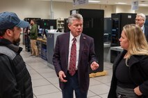 A photo of Rick DeForest speaking to media members.