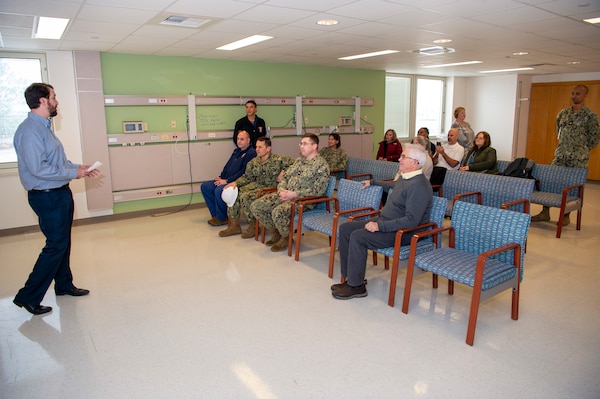 240118-N-MT837-1005 Naval Medical Center Portsmouth (NMCP) welcomed representatives from J&J Worldwide Services, a facilities services government contractor, for an OR (operating room) construction project groundbreaking ceremony, Jan. 18. Prior to the kickoff of the construction, Travis Hawver, J&J senior project manager, spoke to the group.
