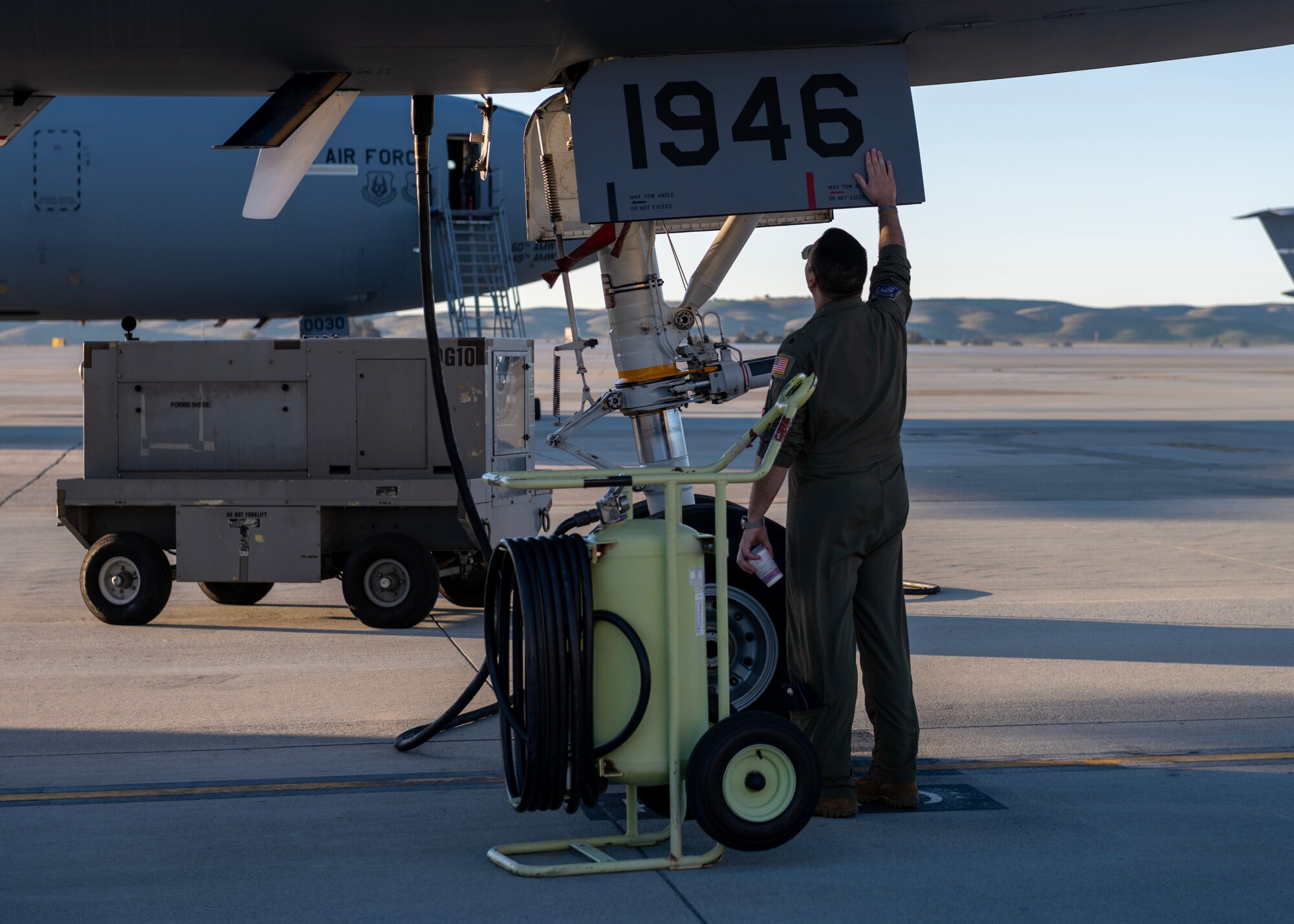 U.S. Air Force Lt. Col. Andrew Baer, 9th Air Refueling Squadron commander and KC-10 Extender pilot, inspects the aircraft.